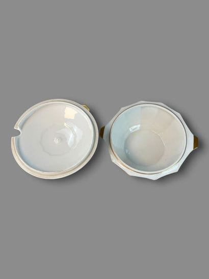 LIMOGES
Porcelain dinner service with a gold...