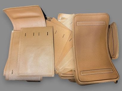 [LEATHER HANDLE]
Box containing scraps of...