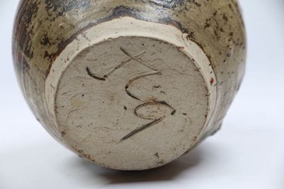 MODERN WORK
A globular stoneware vase with...