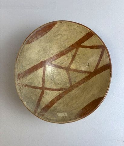 Terracotta bowl with beige and red slip.
H....
