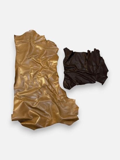 [LEATHER HANDLE]
Box containing leather scraps,...