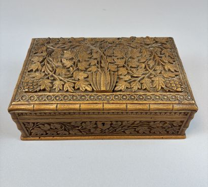 Set of three natural and carved wooden boxes,...