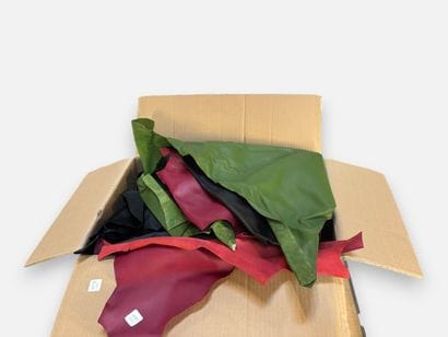 [LEATHER HANDLE]
Box containing black, chartreuse...