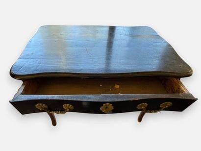 Blackened wooden desk with a drawer that...