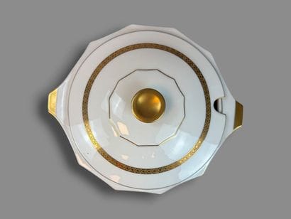 LIMOGES
Porcelain dinner service with a gold...