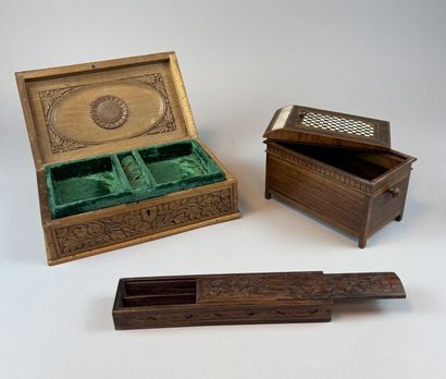 Set of three natural and carved wooden boxes,...