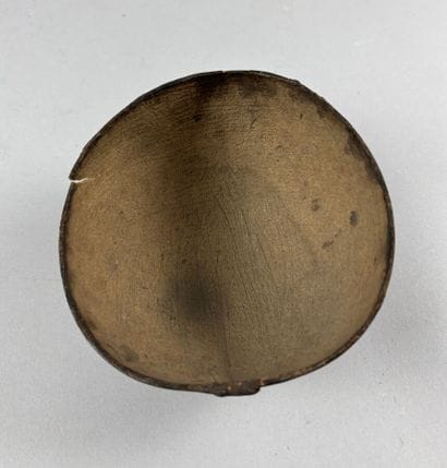 Handcrafted calabash decorated with brown...