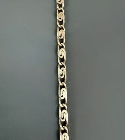 800°/°° silver set consisting of: 
- A double-spiral...