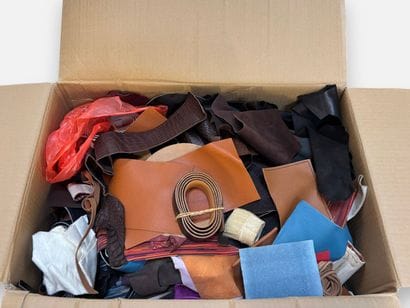 [LEATHER HANDLE]
Box containing various leather...