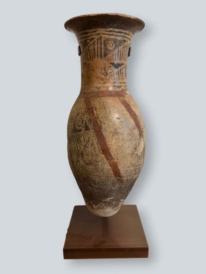 Two terracotta urns with geometric decoration,...