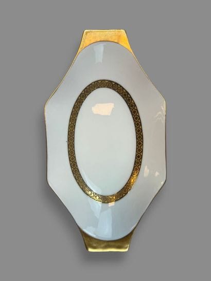 LIMOGES
Porcelain dinner service with a gold...