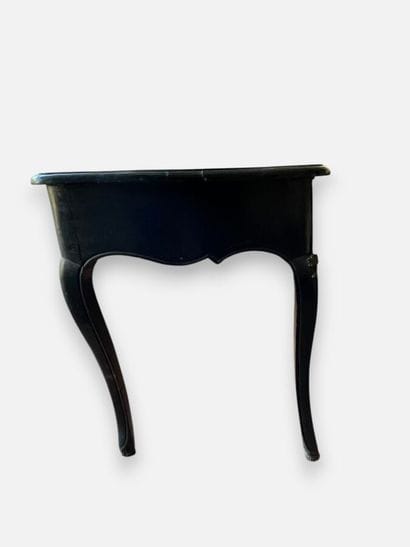 Blackened wooden desk with a drawer that...
