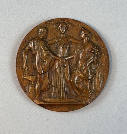 [MEDAL]
Circular bronze medal with a brown...