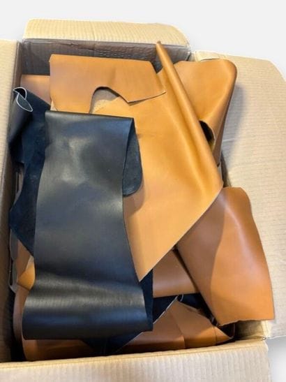 [LEATHER HANDLE]
Box containing scraps of...
