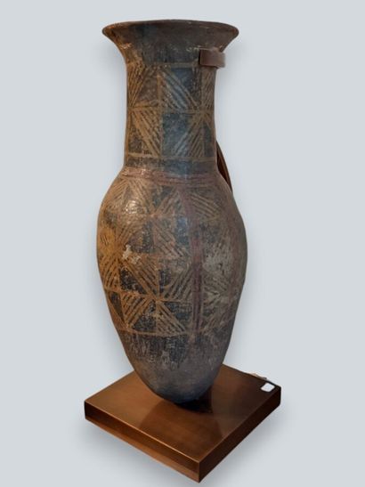 Two terracotta urns with geometric decoration,...