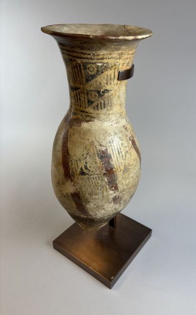 Two terracotta urns with geometric decoration,...