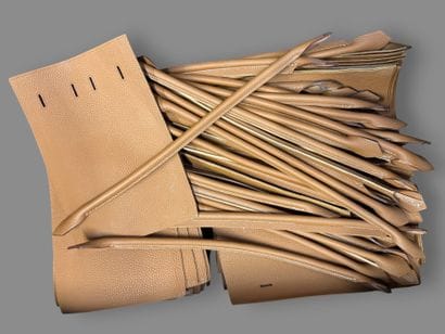[LEATHER HANDLE]
Box containing scraps of...