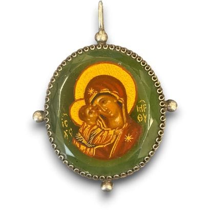 A votive plaque and an engraved brass votive...