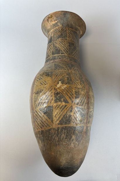 Two terracotta urns with geometric decoration,...