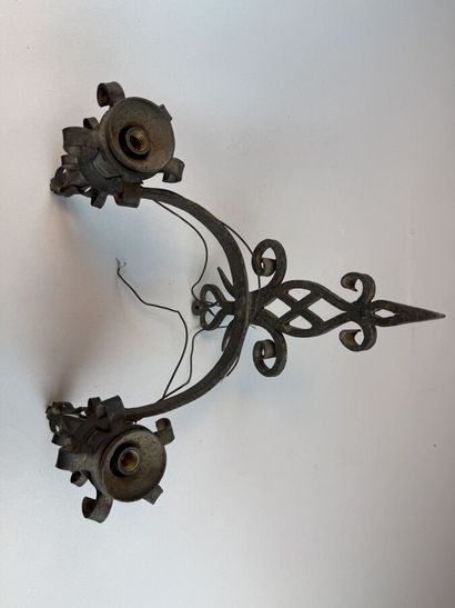 Set of six black-patinated wrought-iron wall...