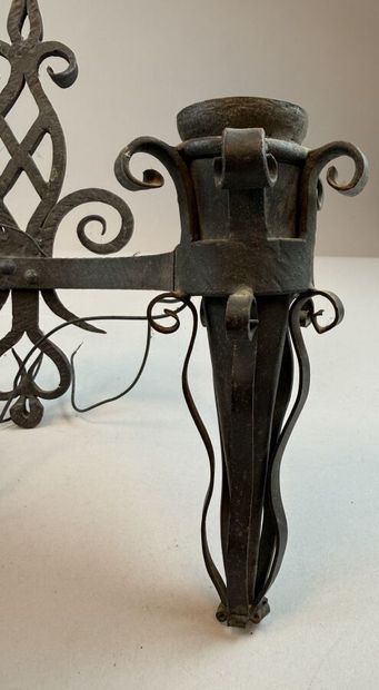 Set of six black-patinated wrought-iron wall...
