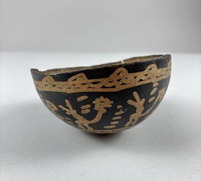 Handcrafted calabash decorated with brown...