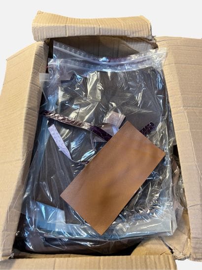 [LEATHER HANDLE]
Box containing leather scraps,...