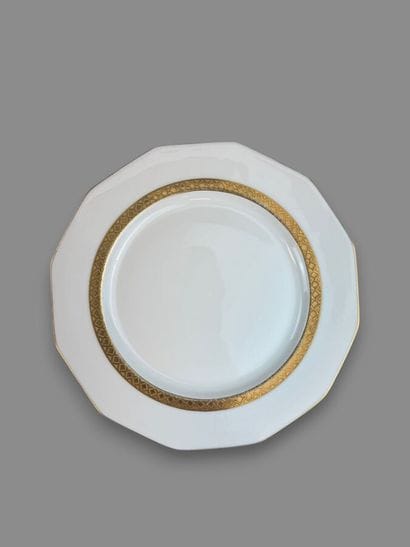 LIMOGES
Porcelain dinner service with a gold...