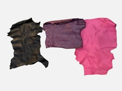 [LEATHER HANDLE]
Box containing goat hides...