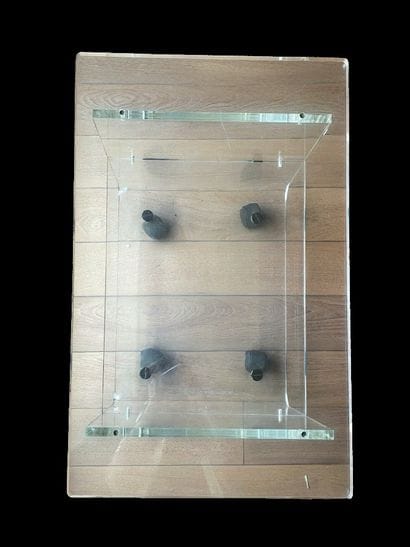 Clear plexiglass table with two shelves,...
