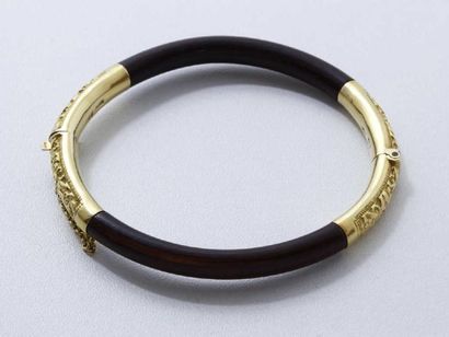 Bracelet jonc ouvrant en or 18 K finement...