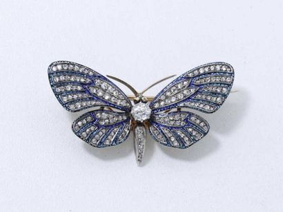 Délicate broche en or 18 K, stylisant un...