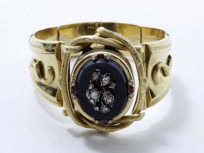 Bracelet articulé en or 18 K, centré d'une...