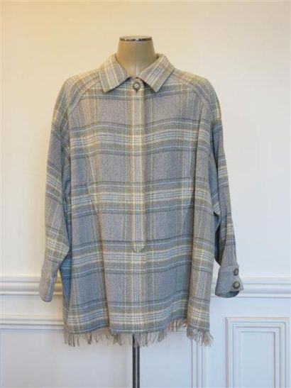 Bernard PERRIS
Veste poncho carreaux gris...