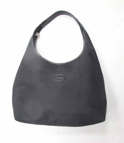 LONCHAMP
Sac porté épaule en tissu et cuir...