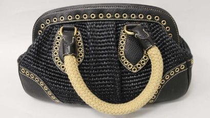 PRADA
Sac à main en cuir tressé et poignées...