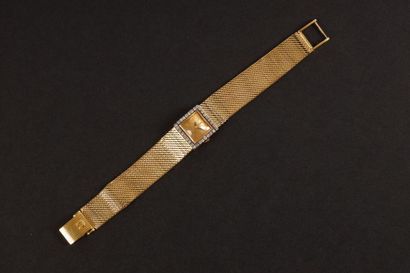Bracelet-montre de dame en or gris, la lunette...