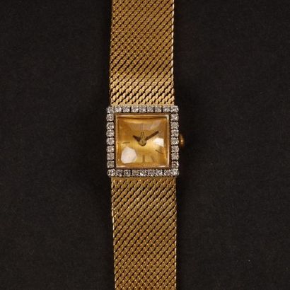 Bracelet-montre de dame en or gris, la lunette...