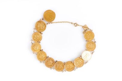 Bracelet en or serti de monnaies mexicaines...