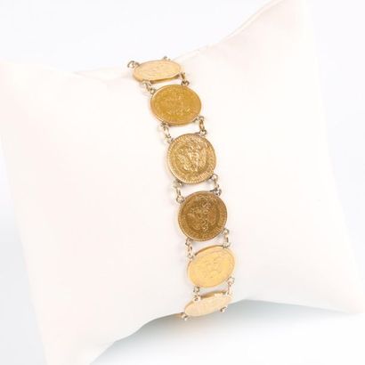 Bracelet en or serti de monnaies mexicaines...
