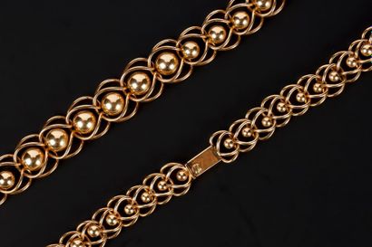 Collier en or rose en chute ornée de boules...