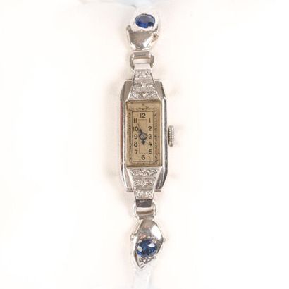 Bracelet-montre de dame en or gris, les attaches...