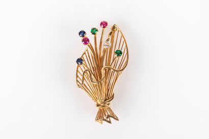Broche bouquet en or sertie de petites pierres...
