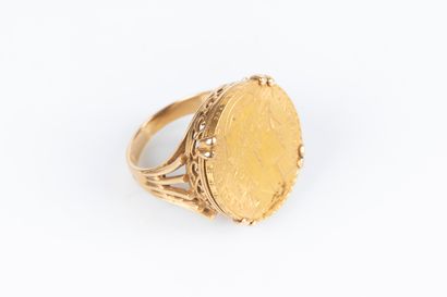 Bague en or sertie d'une monnaie de 20 FF...