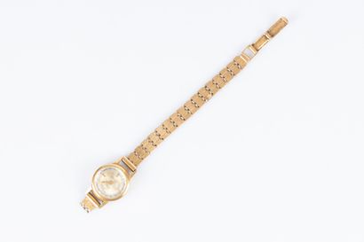 Bracelet-montre de dame en or, le bracelet...
