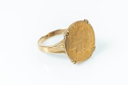 Bague en or sertie d'une monnaie de 10 FF...