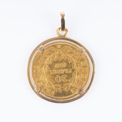 Pendentif en or serti d'une pièce de 20 FF...