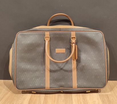 DIOR. Bagages en toile enduite noir siglée...