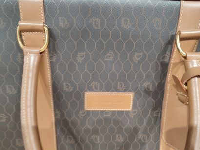 DIOR. Bagages en toile enduite noir siglée...