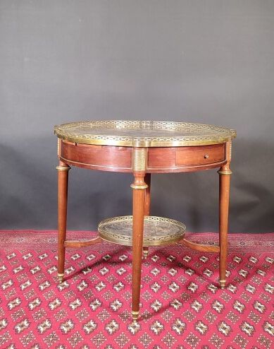 Round mahogany and mahogany veneer pedestal...